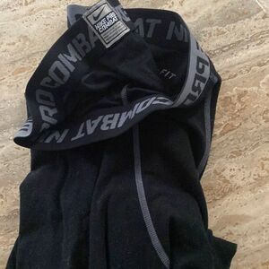 Nike pro combat dry fit size large, men’s black pants